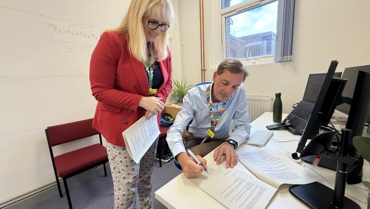 Sue and Simon sign the MOU